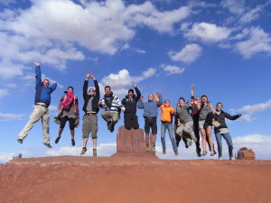 Trexpert image: Trek America tour group jumping in Monument Valley